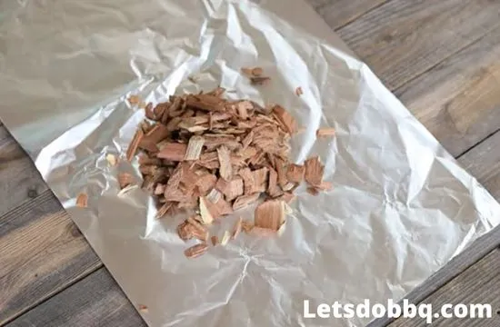 keep woodchips in aluminum foil from burning in smoker